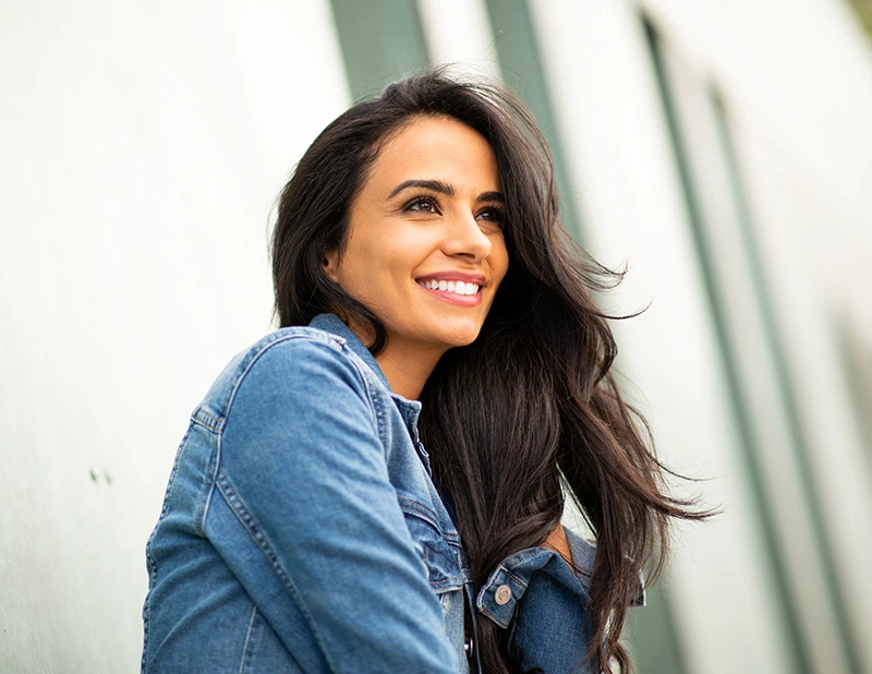 Attractive brunette woman in denim jacket