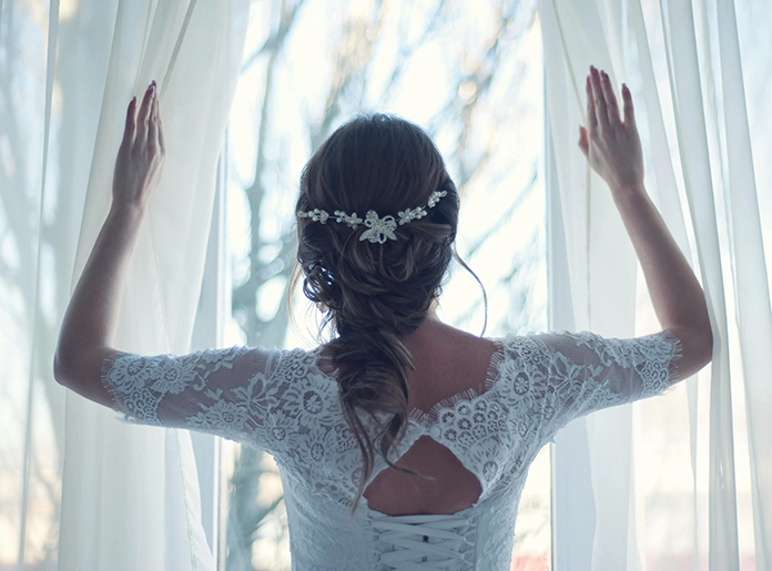 bride looking through window