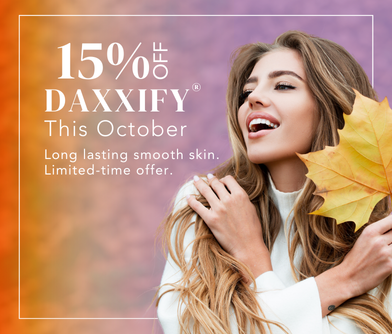 young brunette woman smiling with autumn leaf